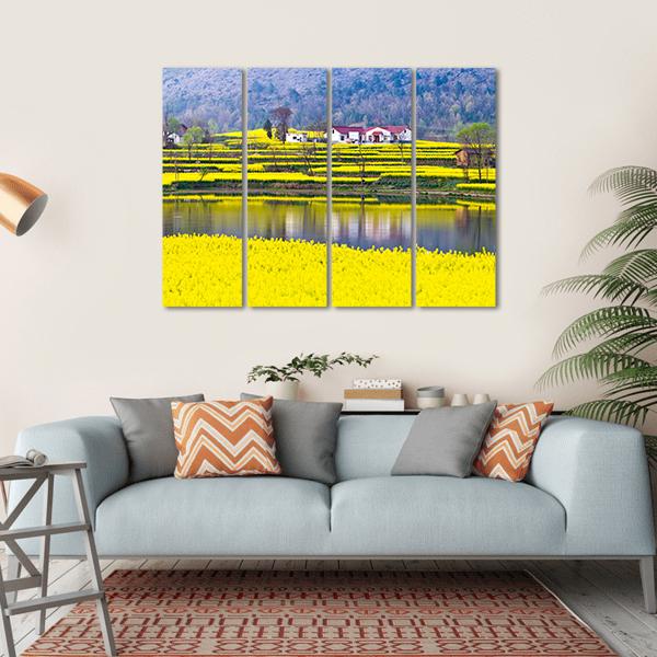 Rural Spring Scenery Canvas Wall Art in yellow, green and blue, single panel hung on a wall