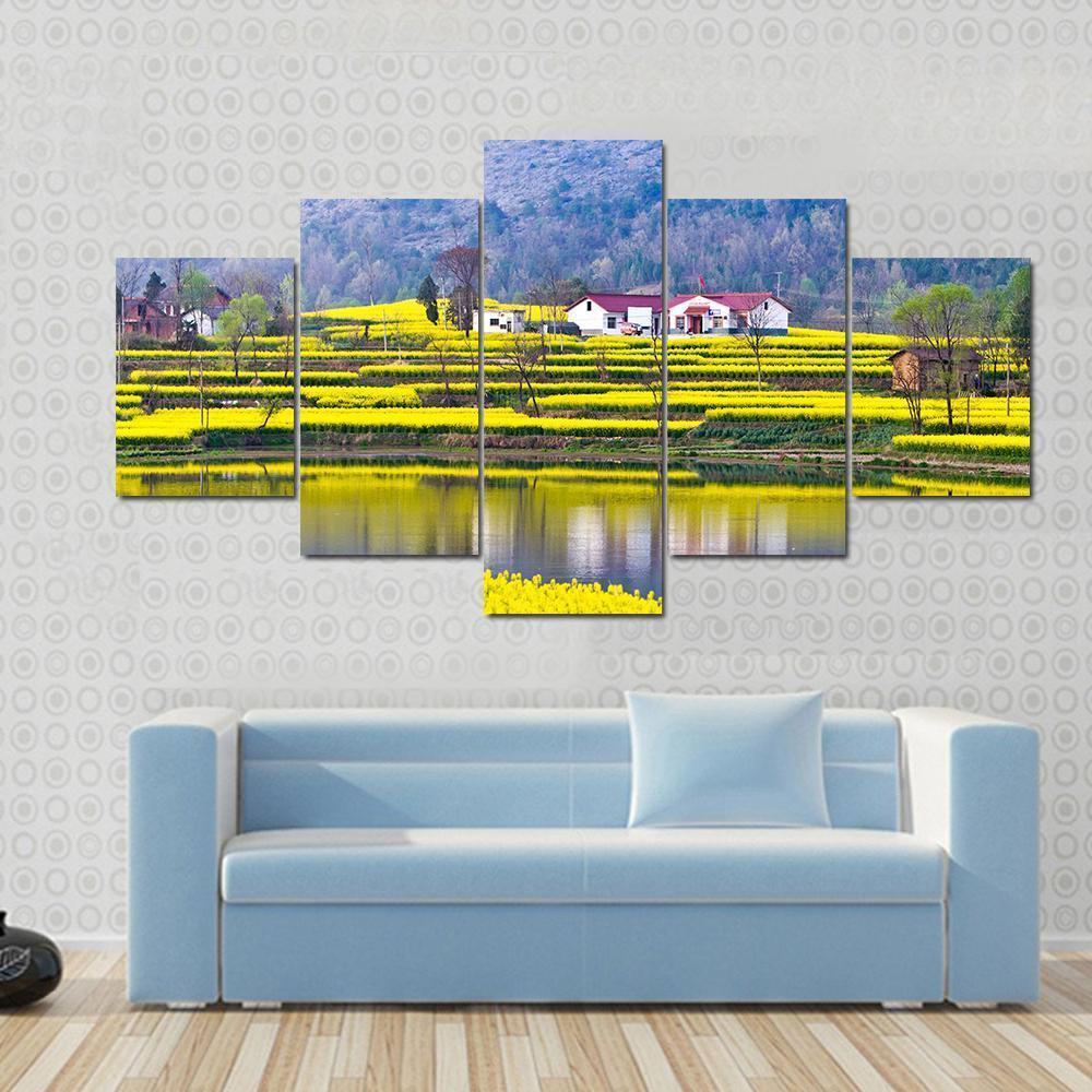 Rural Spring Scenery Canvas Wall Art in yellow, green and blue, 5 panel Star layout hung on a wall