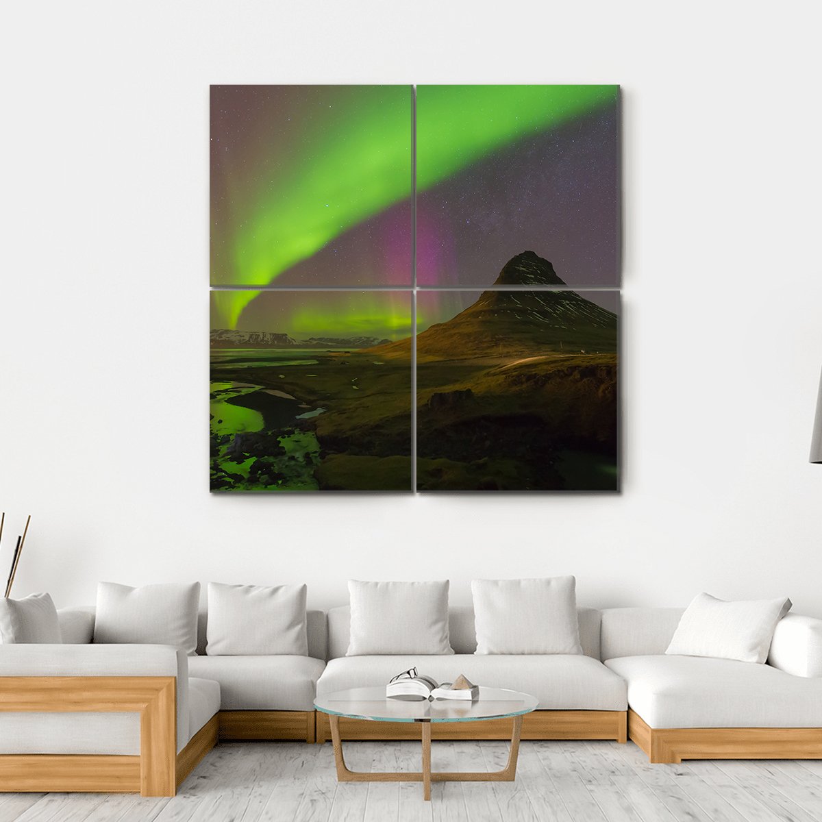 Northern Lights Over Kirkjufell Canvas Wall Art in black, green and purple, hung on a wall