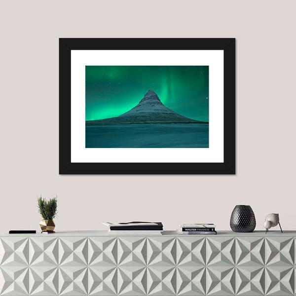 Aurora Over Kirkjufell Canvas Wall Art in green and blue, framed print, product view on a white background