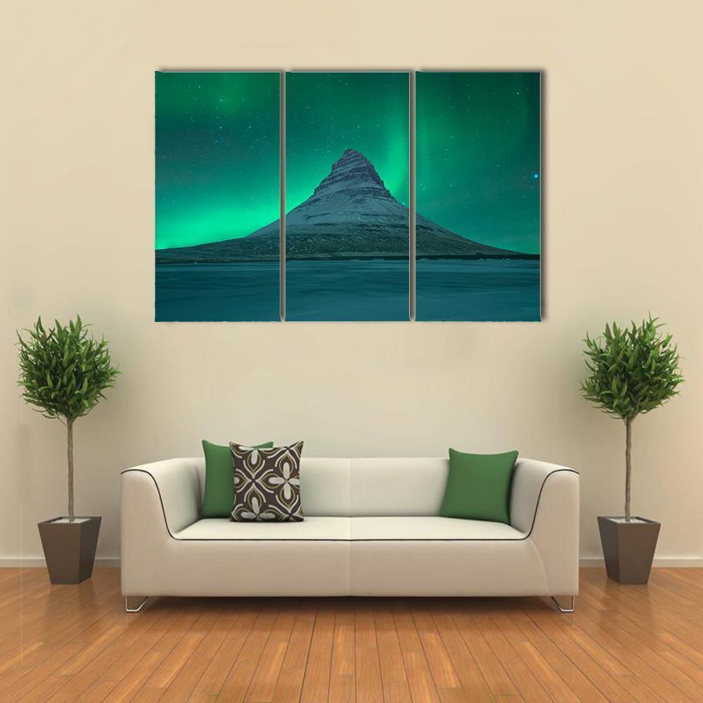Aurora Over Kirkjufell Canvas Wall Art in green and blue, 5 panel Star layout hung on a wall