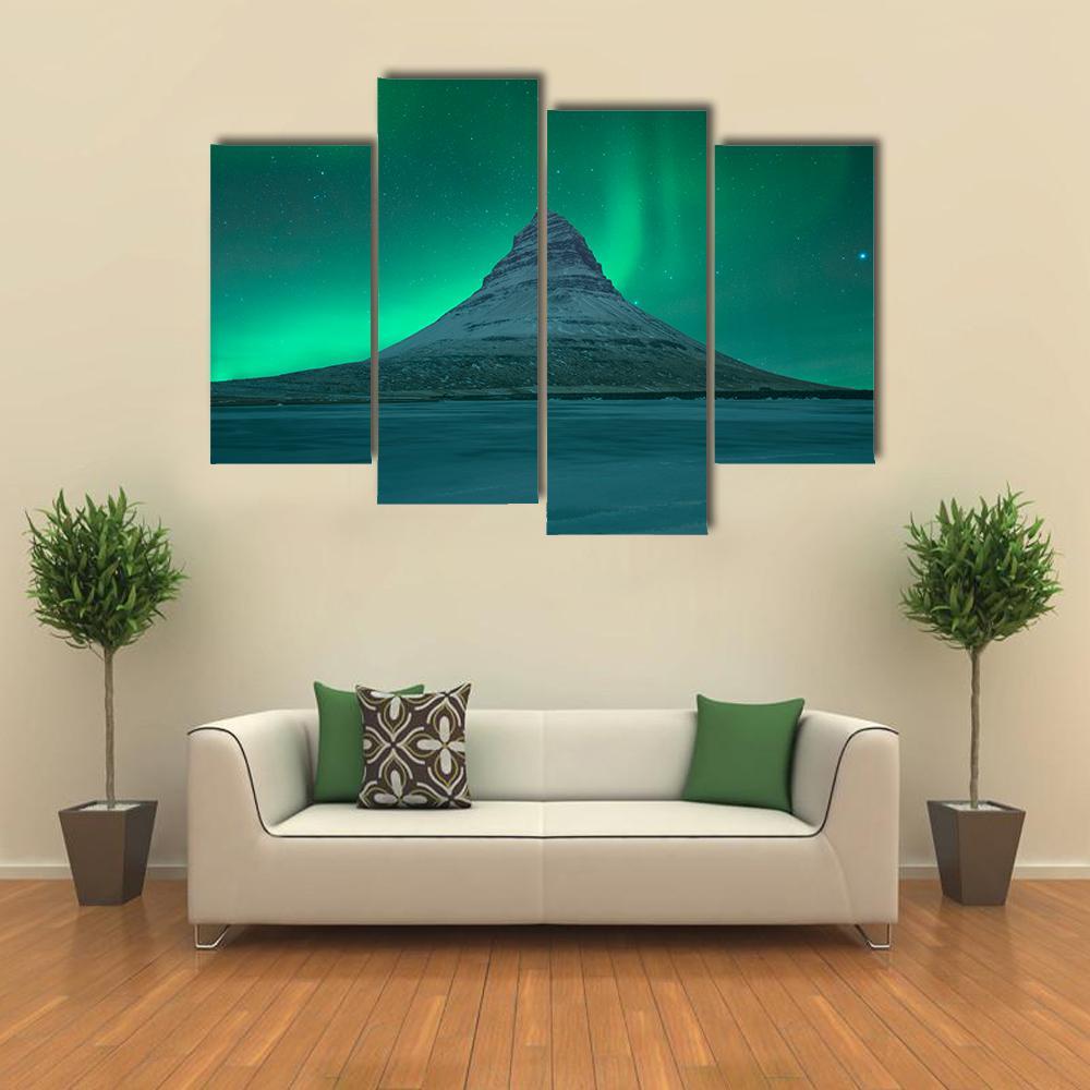 Aurora Over Kirkjufell Canvas Wall Art in green and blue, 5 panel Star layout hung on a wall