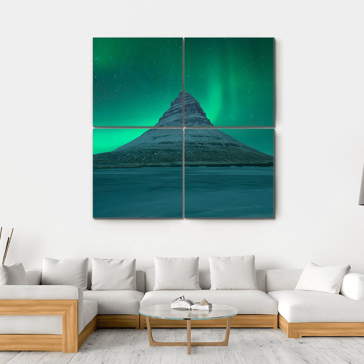 Northern Lights Over Mount Kirkjufell Canvas Wall Art in green and blue, hung on a wall