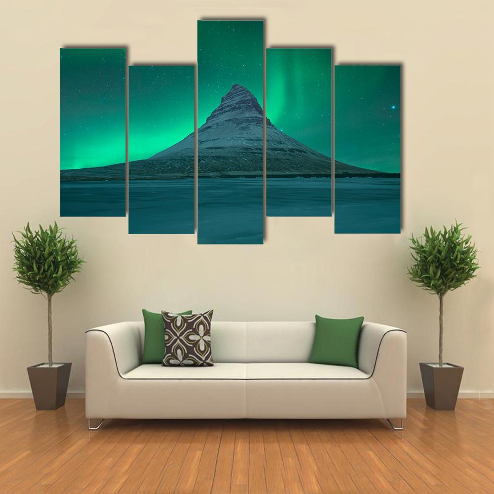 Aurora Over Kirkjufell Canvas Wall Art in green and blue, 5 panel Pop layout hung on a wall