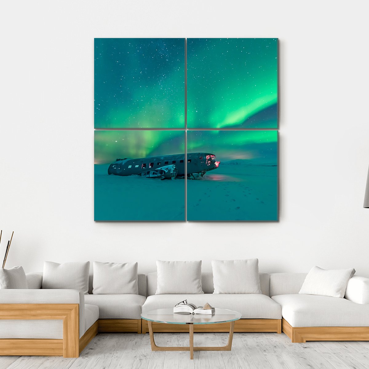 Northern Lights Over Plane Wreck Canvas Wall Art in green and blue, hung on a wall