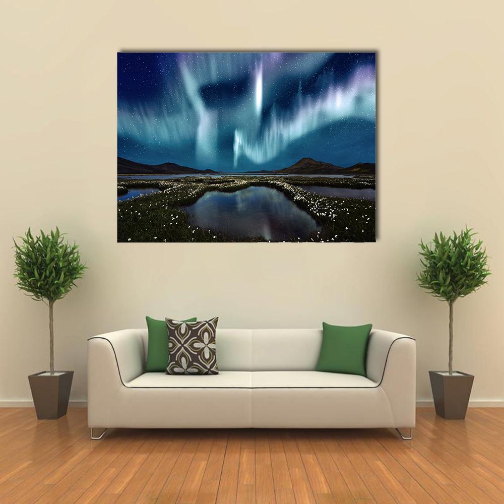 Northern Lights Over Wildflowers Canvas Wall Art in green, blue and purple, single panel hung on a wall