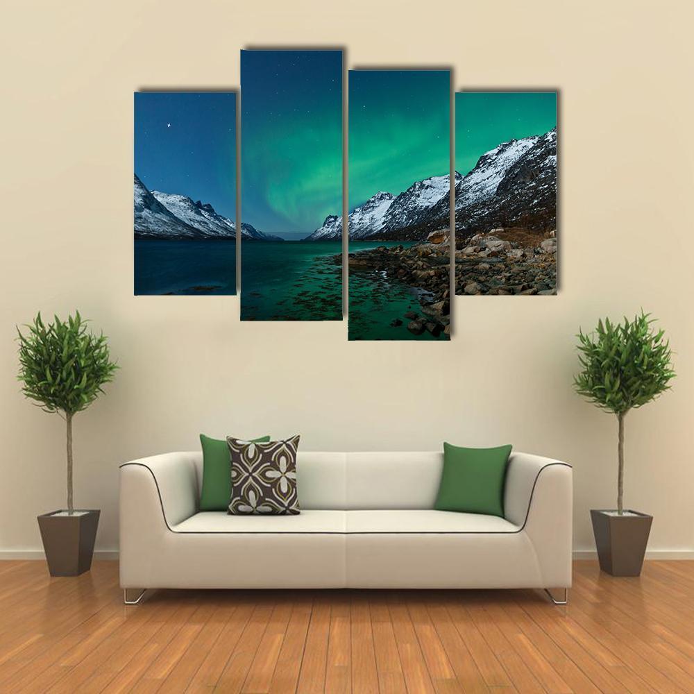 Aurora Borealis Over Fjords Canvas Wall Art in black, green and blue, 4 panel Pop layout hung on a wall