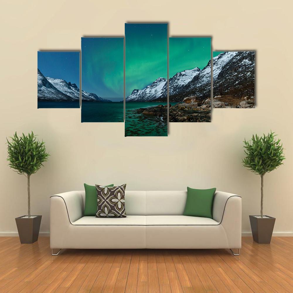 Aurora Borealis Over Fjords Canvas Wall Art in black, green and blue, 5 panel Pop layout hung on a wall
