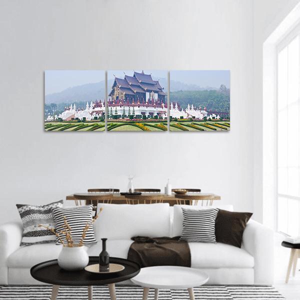 Northern Thai Pavilion with Lanna Roofs Panoramic Canvas Wall Art in white, green and blue, hung on a wall
