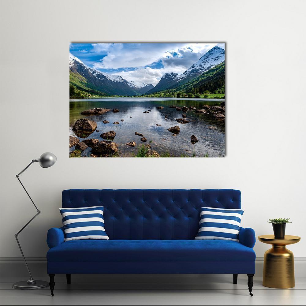 Norwegian Lake with Snow-capped Mountains Canvas Wall Art in white, green and blue, single panel hung on a wall