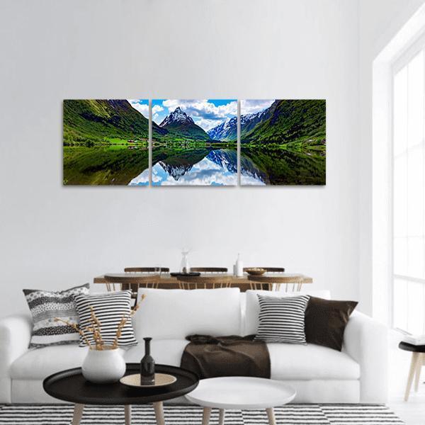 Norway Mountain Lake Landscape Panoramic Canvas Wall Art in white, green and blue, hung on a wall