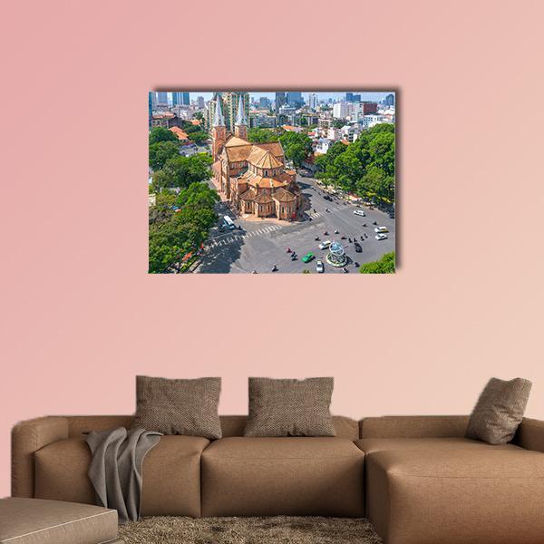 Notre Dame Cathedral Aerial View Canvas Wall Art in gray, brown and green, single panel hung on a wall