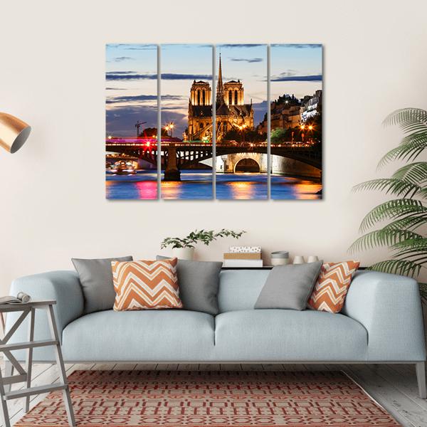 Notre Dame Cathedral Paris at Dusk Canvas Wall Art in gold, orange and blue, single panel hung on a wall