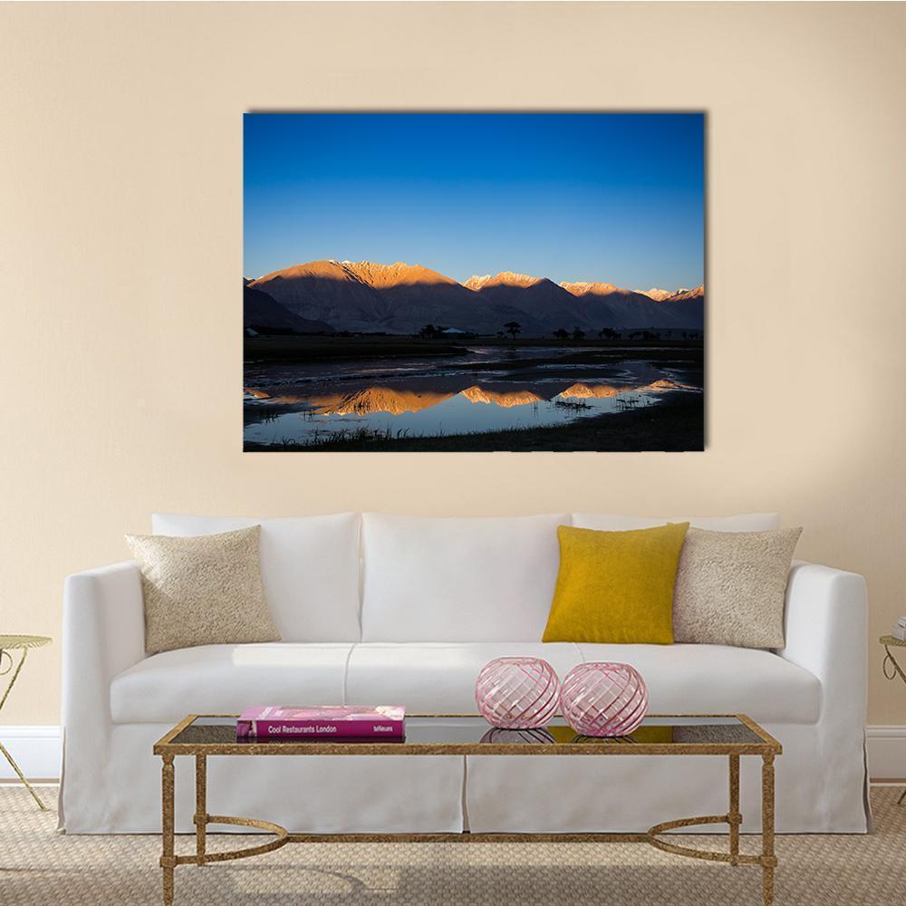 Nubra River Reflection at Sunset Canvas Wall Art in brown, orange and blue, single panel hung on a wall