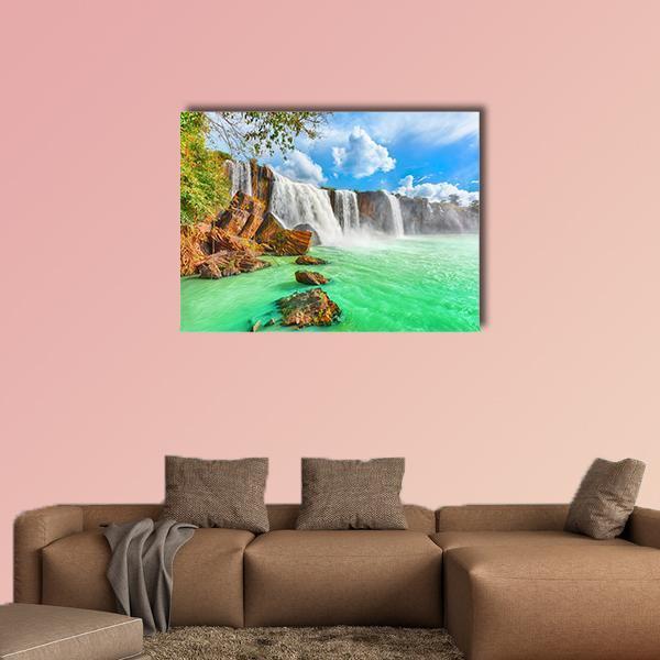 Nur Waterfall Vietnam Canvas Wall Art in white, green and blue, single panel hung on a wall