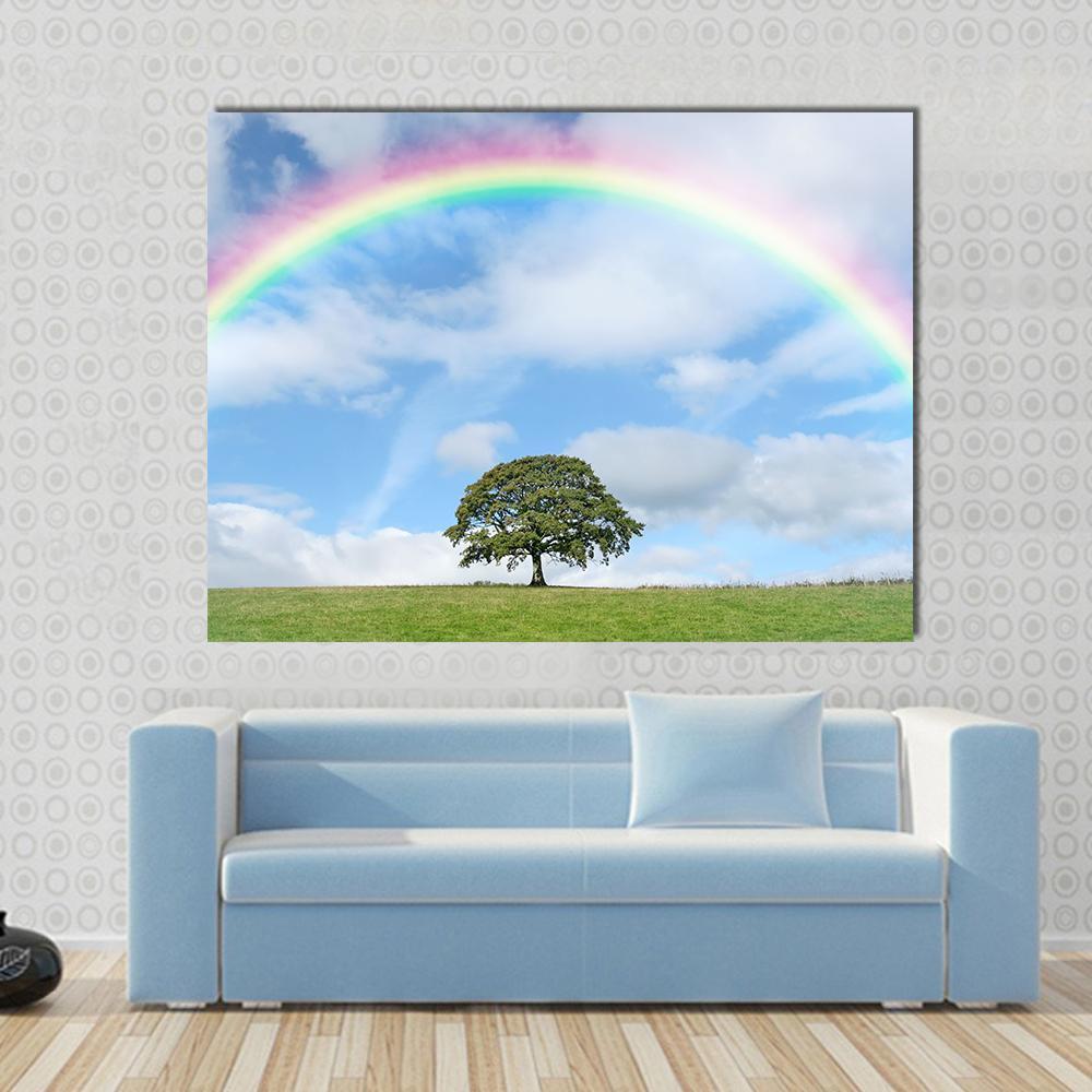 Oak Tree Under Rainbow Canvas Wall Art in white, green and blue, single panel hung on a wall