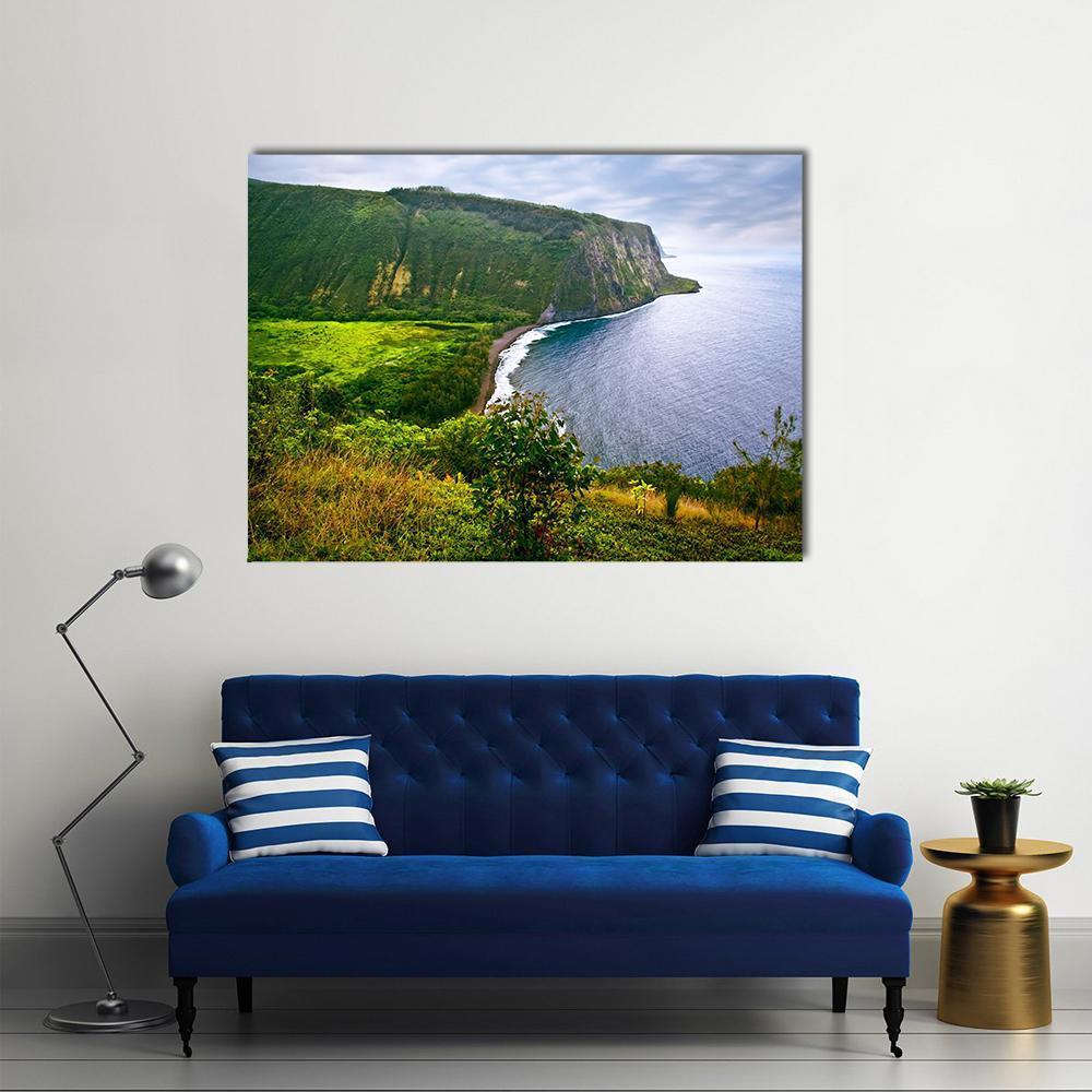 Ocean Cliffside on a Green Island Canvas Wall Art in green and blue, single panel hung on a wall
