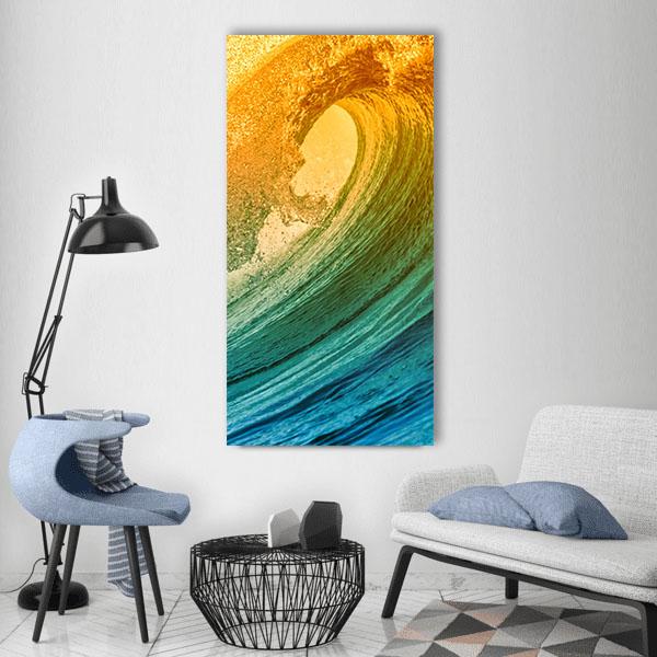 Morning Ocean Wave Vertical Canvas Wall Art in yellow, green and blue, single vertical panel hung on a wall