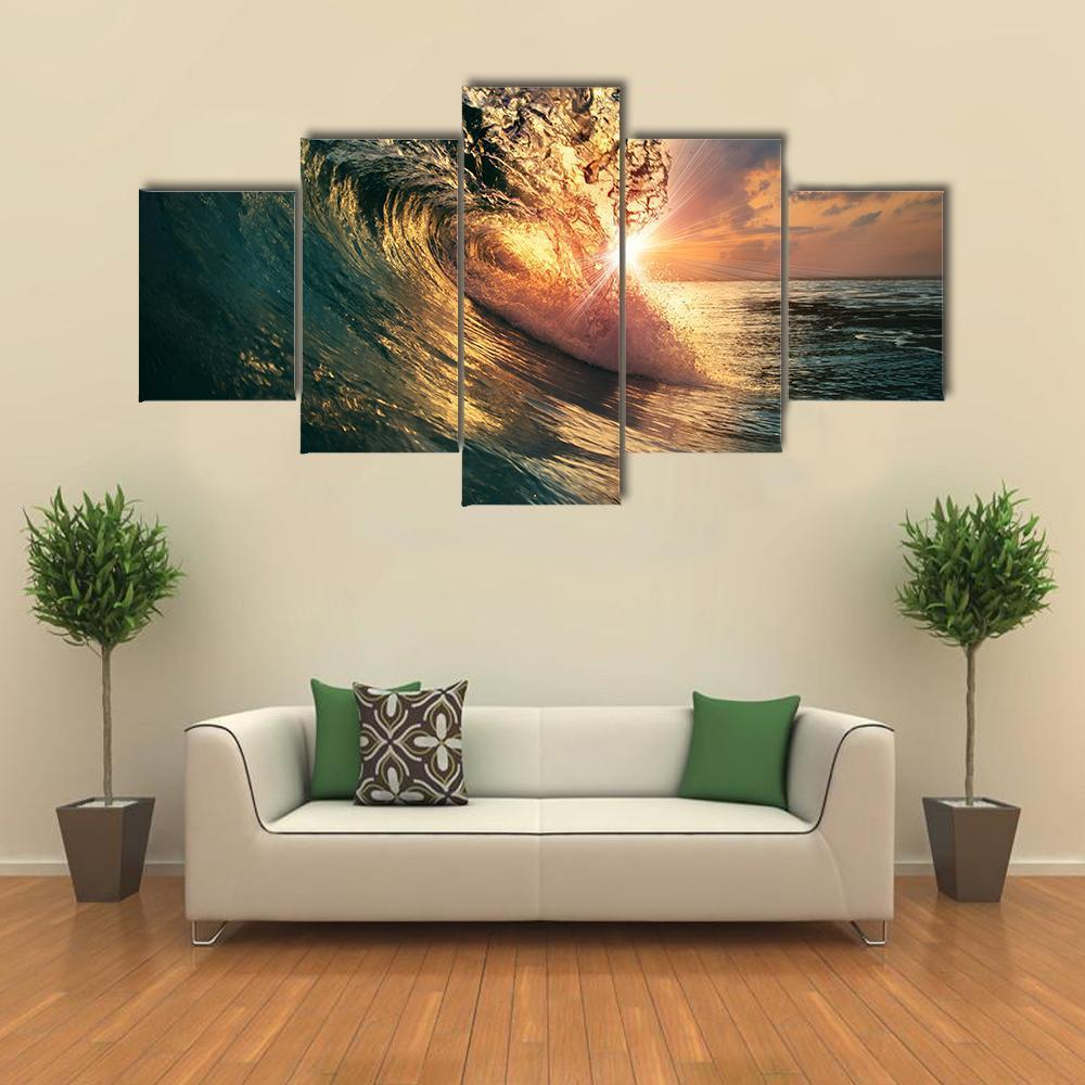 Sunlit Ocean Wave at Sunset Canvas Wall Art in orange, yellow and blue, 5 panel Star layout hung on a wall