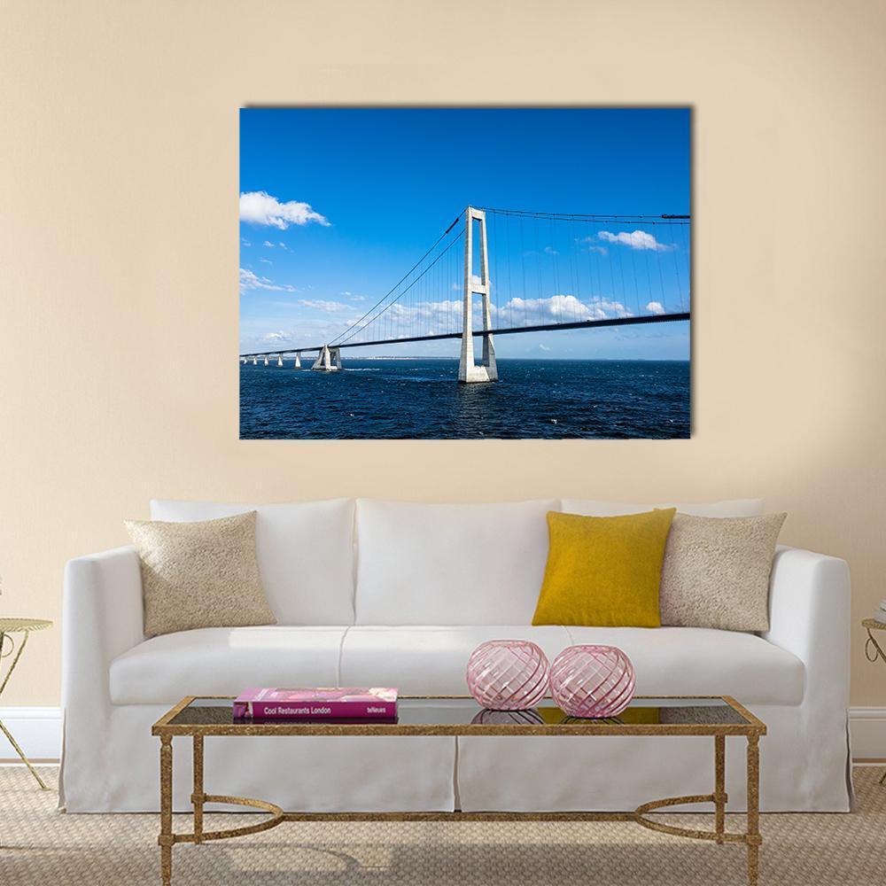 Oresund Bridge Over Calm Waters Canvas Wall Art in white and blue, single panel hung on a wall