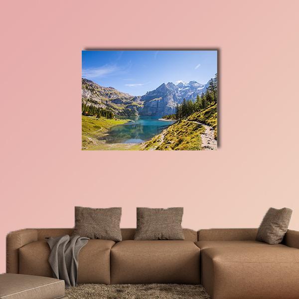 Oeschinen Lake and Snow-capped Mountains Canvas Wall Art in white, green and blue, single panel hung on a wall