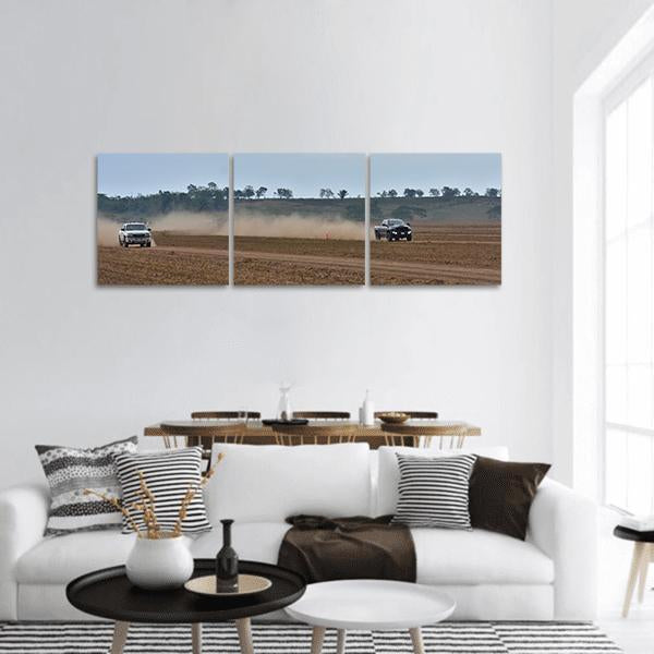 Off-road Truck Race Panoramic Canvas Wall Art in gray, brown and blue, hung on a wall