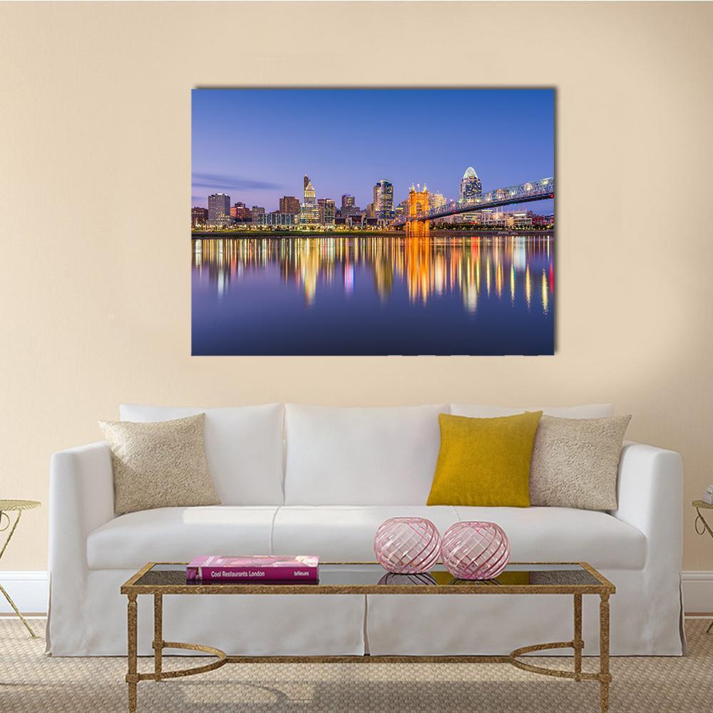 Ohio City Skyline with River Reflections Canvas Wall Art in orange, blue and purple, single panel hung on a wall