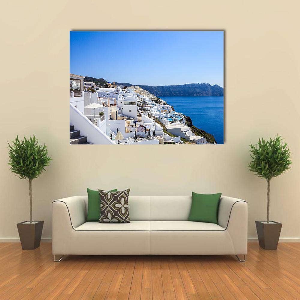 Santorini Island in Daylight Canvas Wall Art in white and blue, single panel hung on a wall