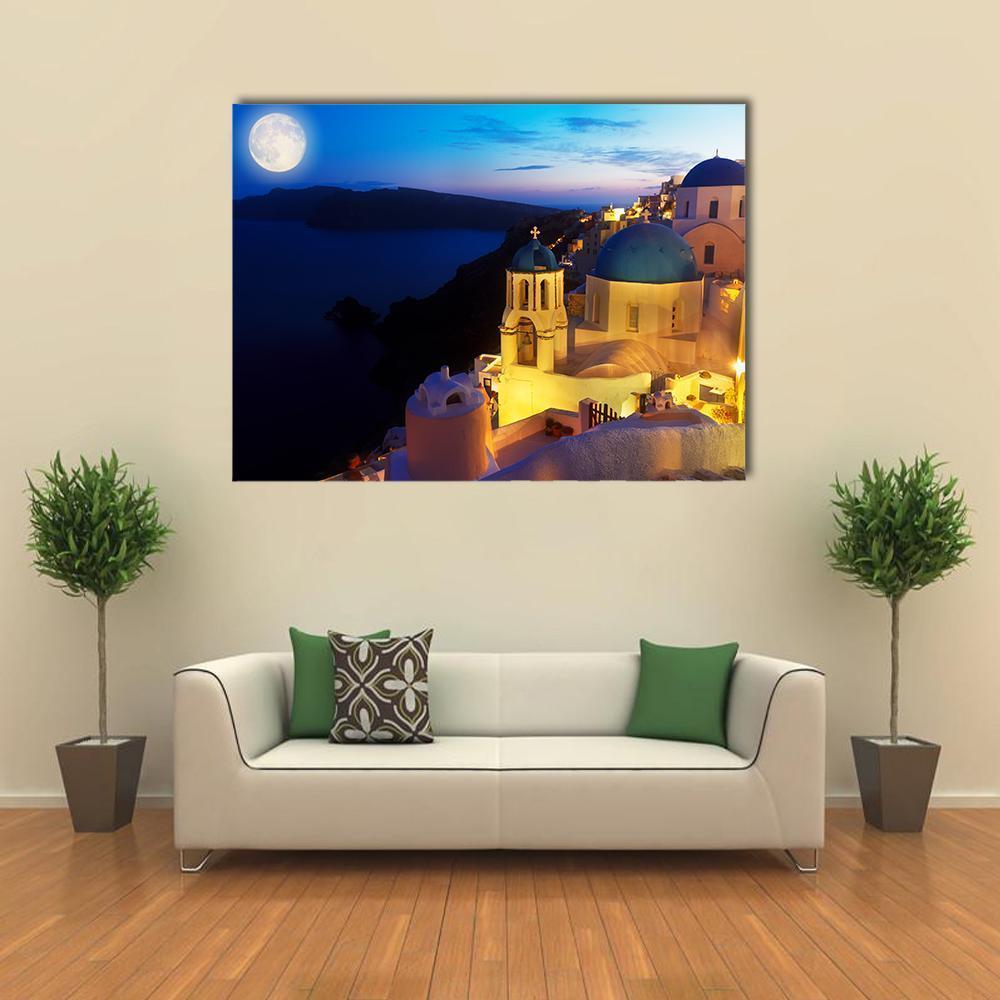 Night Over Oia Village in Santorini Canvas Wall Art in yellow, blue and navy, single panel hung on a wall