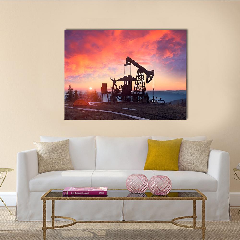 Oil Pumpjack at Sunset Canvas Wall Art in black, orange and pink, single panel hung on a wall