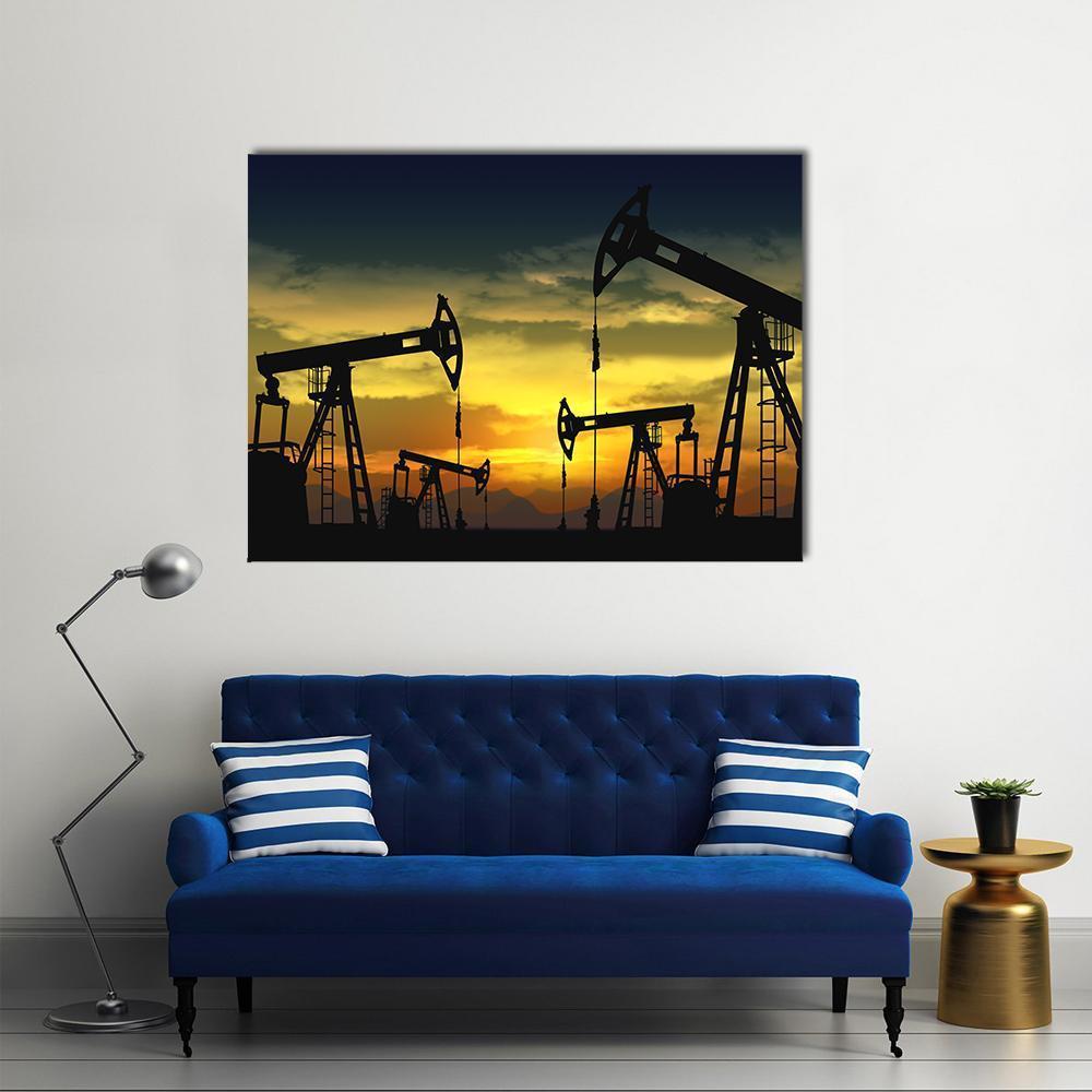 Oil Pump Jacks at Sunset Canvas Wall Art in black, orange and yellow, single panel hung on a wall