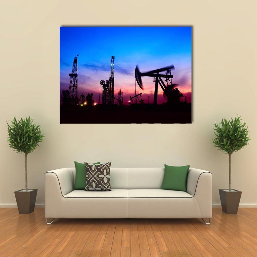 Oil Pumping Unit Silhouette Canvas Wall Art in black, blue and purple, single panel hung on a wall