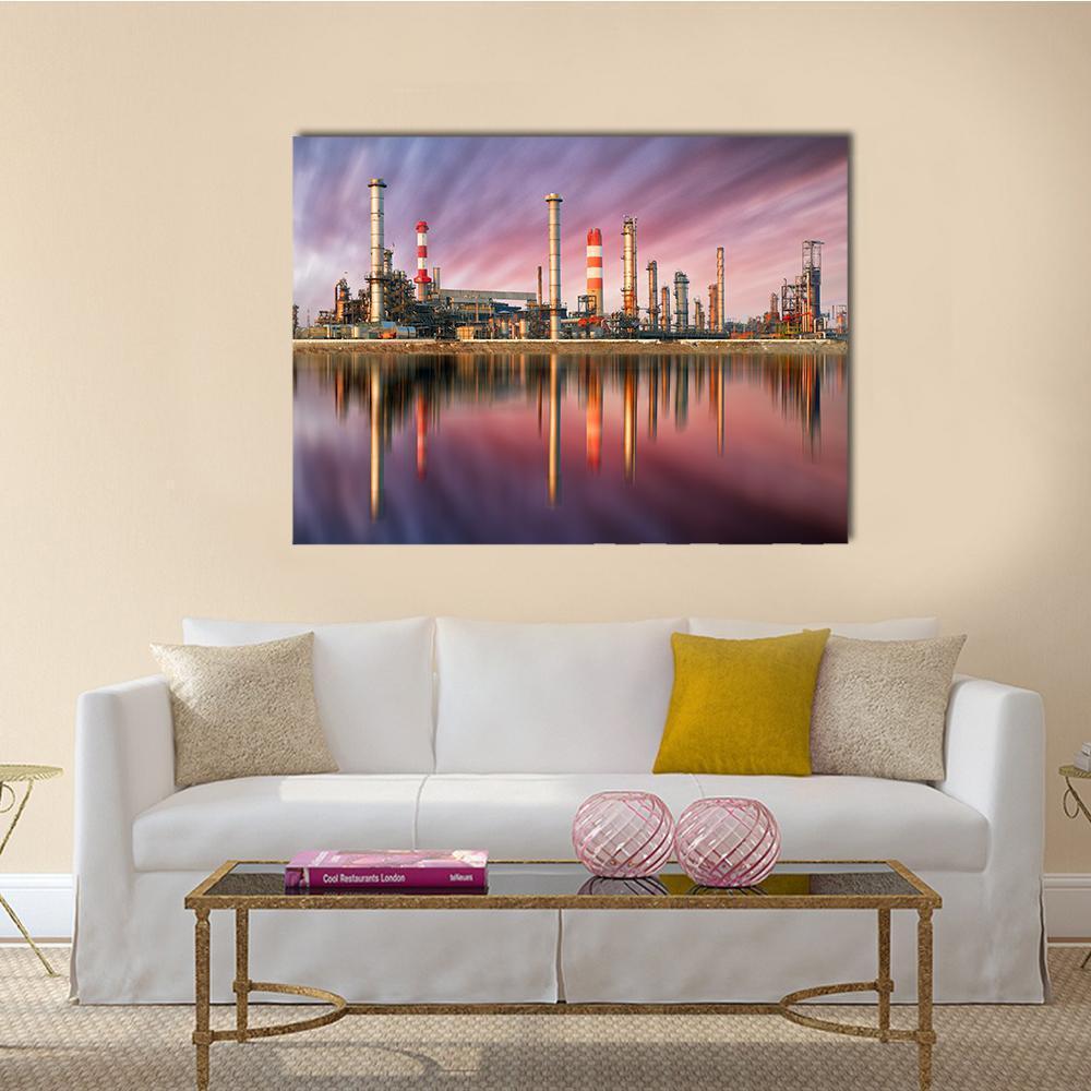 Oil Refinery at Sunset Canvas Wall Art in orange, purple and pink, single panel hung on a wall