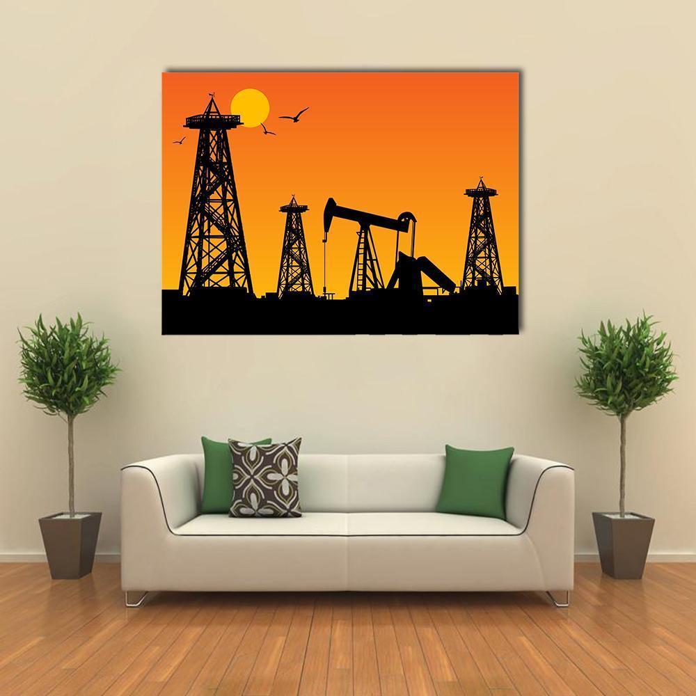 Oil Rig Silhouettes at Sunset Canvas Wall Art in black, orange and yellow, single panel hung on a wall