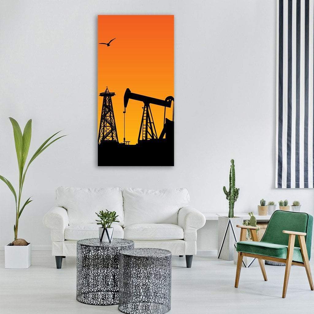 Oil Rig Silhouettes at Sunset Vertical Canvas Wall Art in black, orange and yellow, single vertical panel hung on a wall