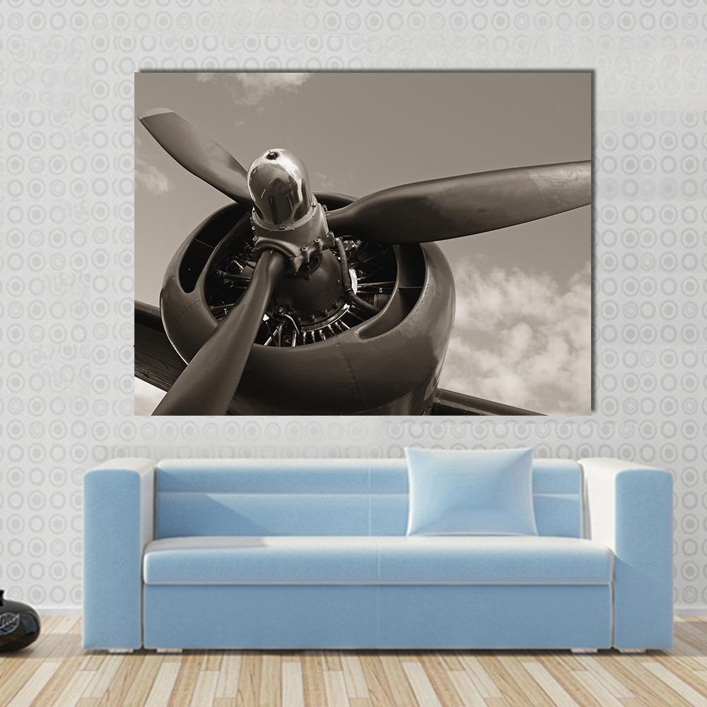 Old Airplane Propeller Canvas Wall Art in black, gray and brown, single panel hung on a wall