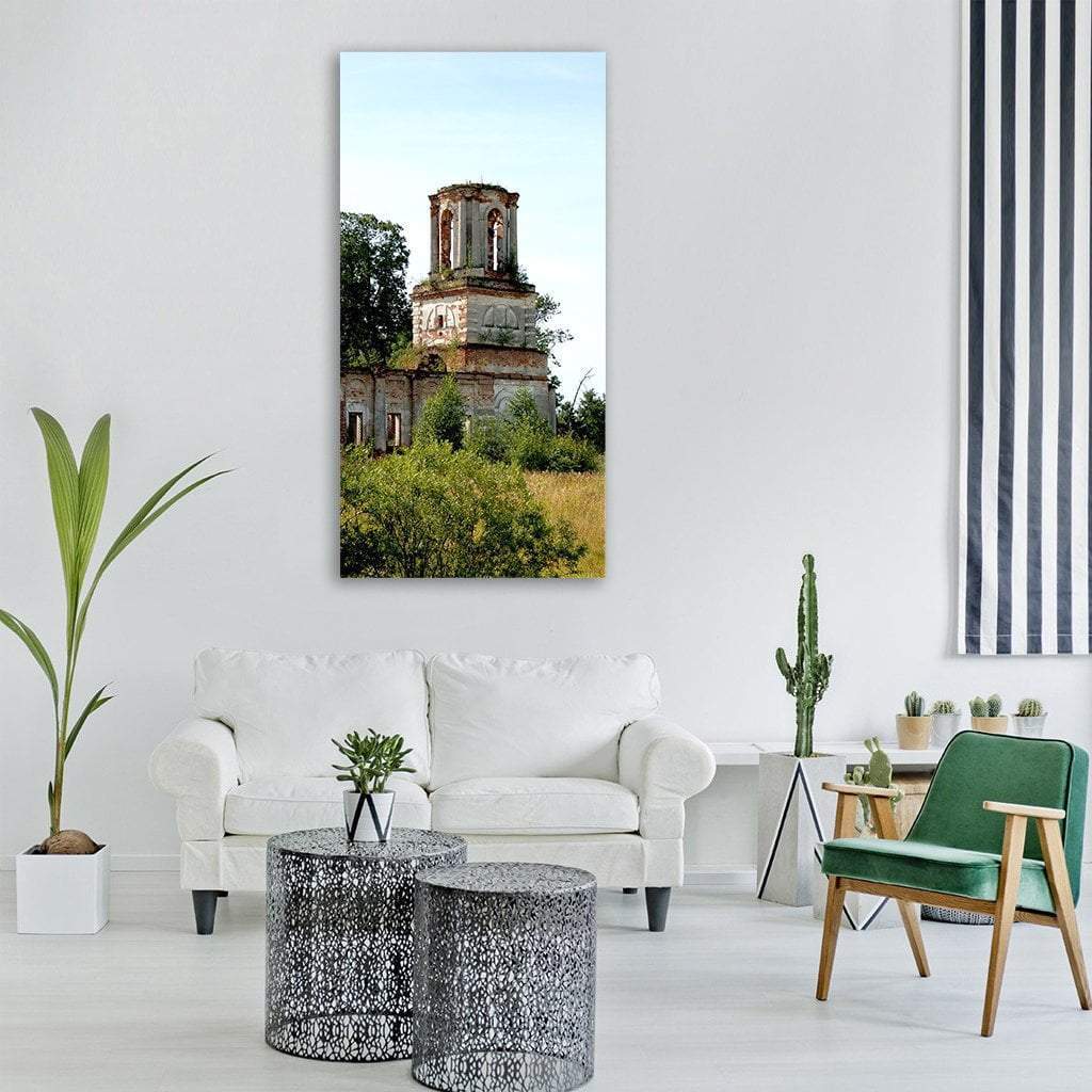 Crumbling Red Brick Church Tower Vertical Canvas Wall Art in red, green and blue, single vertical panel hung on a wall