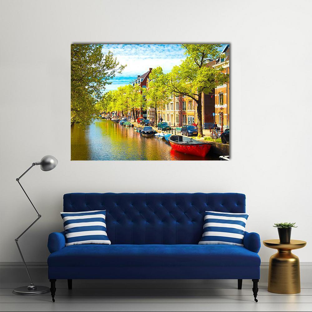 Picturesque Canal Houses with Boats Canvas Wall Art in brown, green and blue, single panel hung on a wall