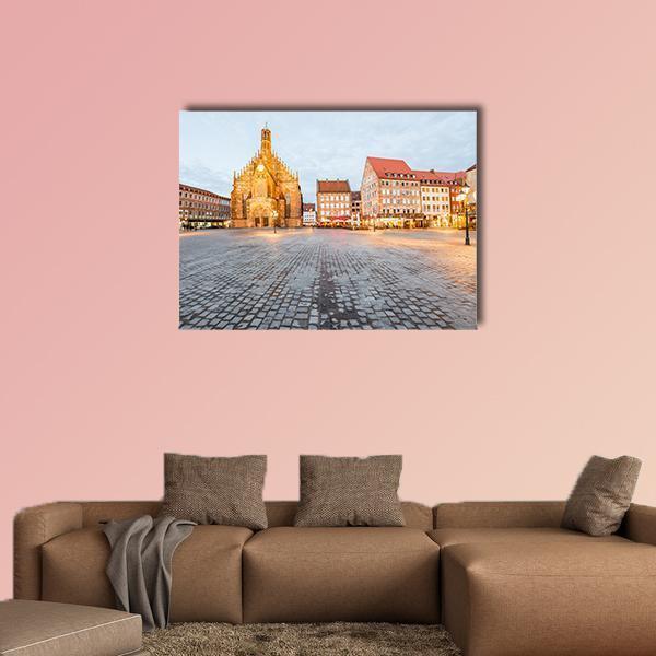 Gothic Cathedral on Cobblestone Square Canvas Wall Art in gray, beige and brown, single panel hung on a wall