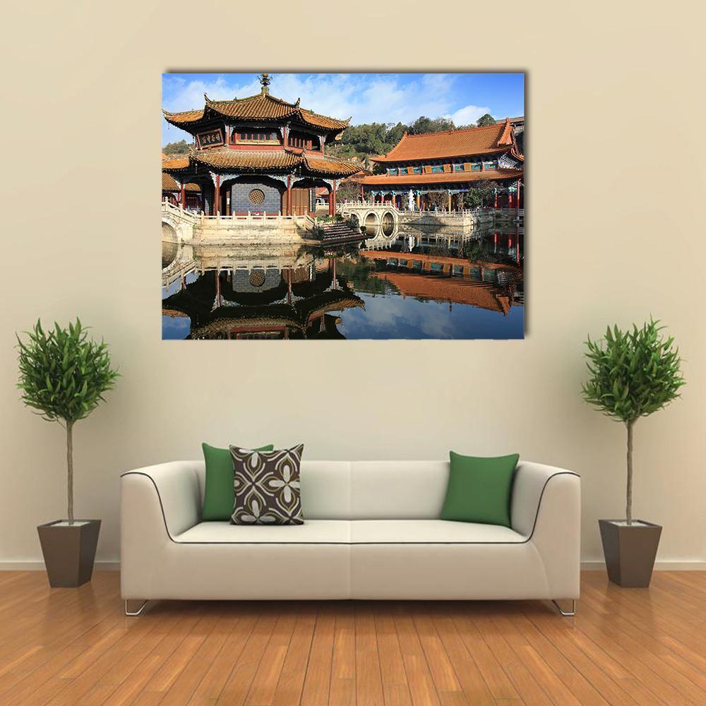 Traditional Chinese Temple by Calm Water Canvas Wall Art in brown, orange and blue, single panel hung on a wall