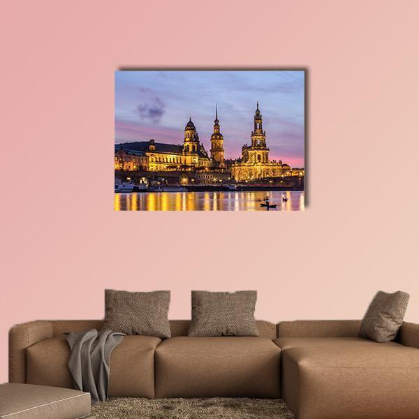 Dresden Riverfront at Sundown Canvas Wall Art in yellow, blue and purple, single panel hung on a wall