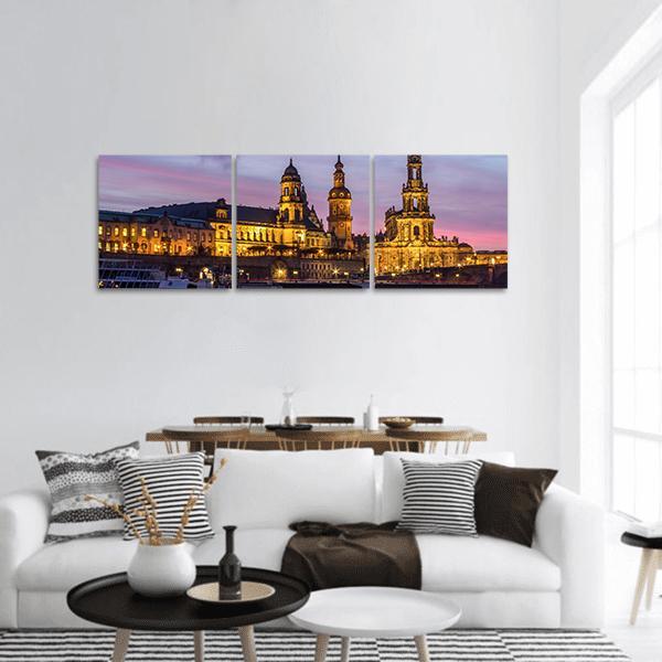 Dresden at Sundown Panoramic Canvas Wall Art in yellow, blue and purple, hung on a wall