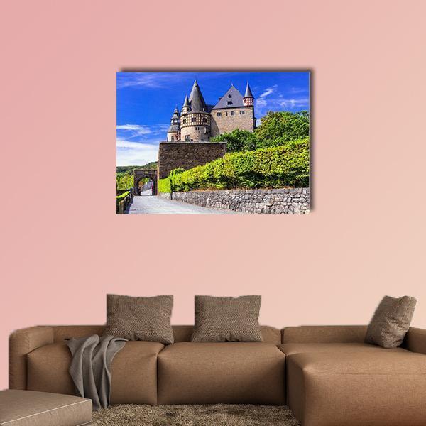 Old Burresheim Castle with Spired Towers Canvas Wall Art in brown, green and blue, single panel hung on a wall