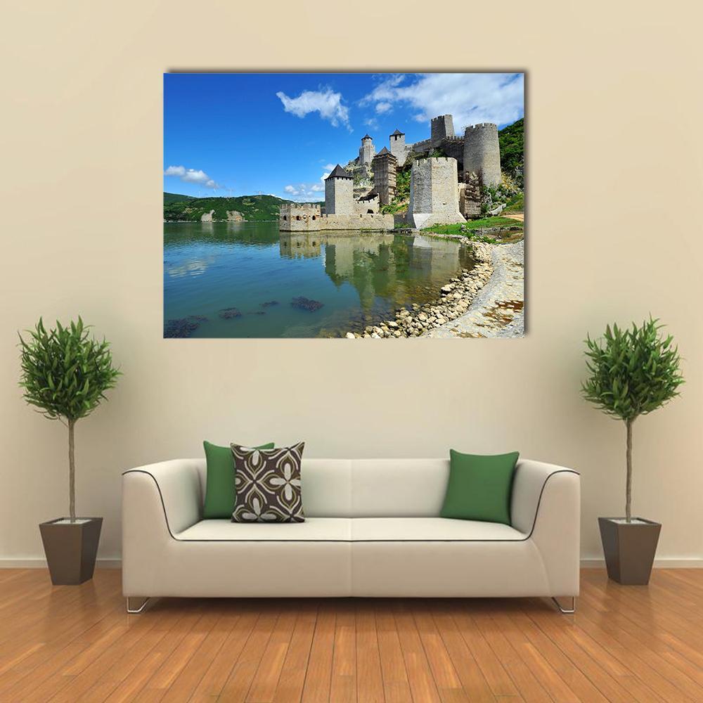 Golubac Castle by Calm Water Canvas Wall Art in gray, green and blue, single panel hung on a wall