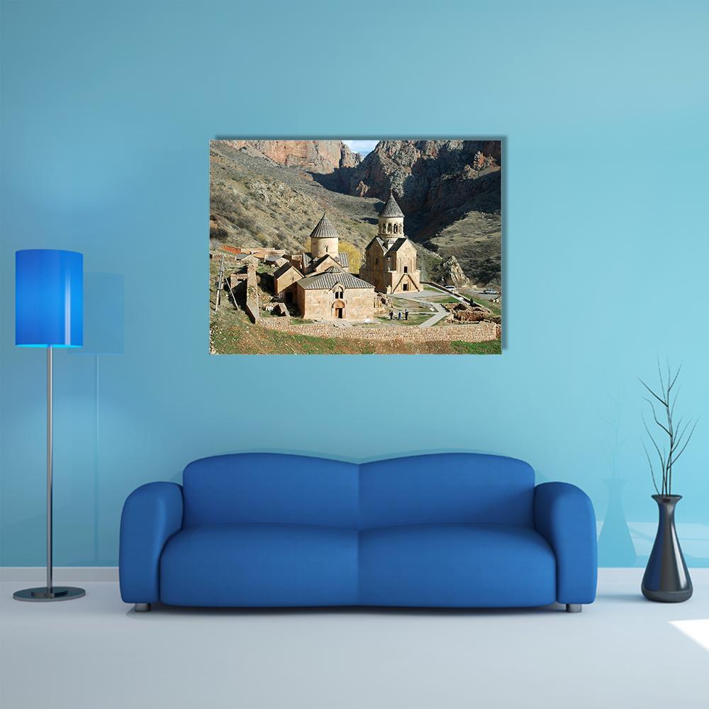 Medieval Monastery in Mountain Gorge Canvas Wall Art in gray, beige and brown, single panel hung on a wall