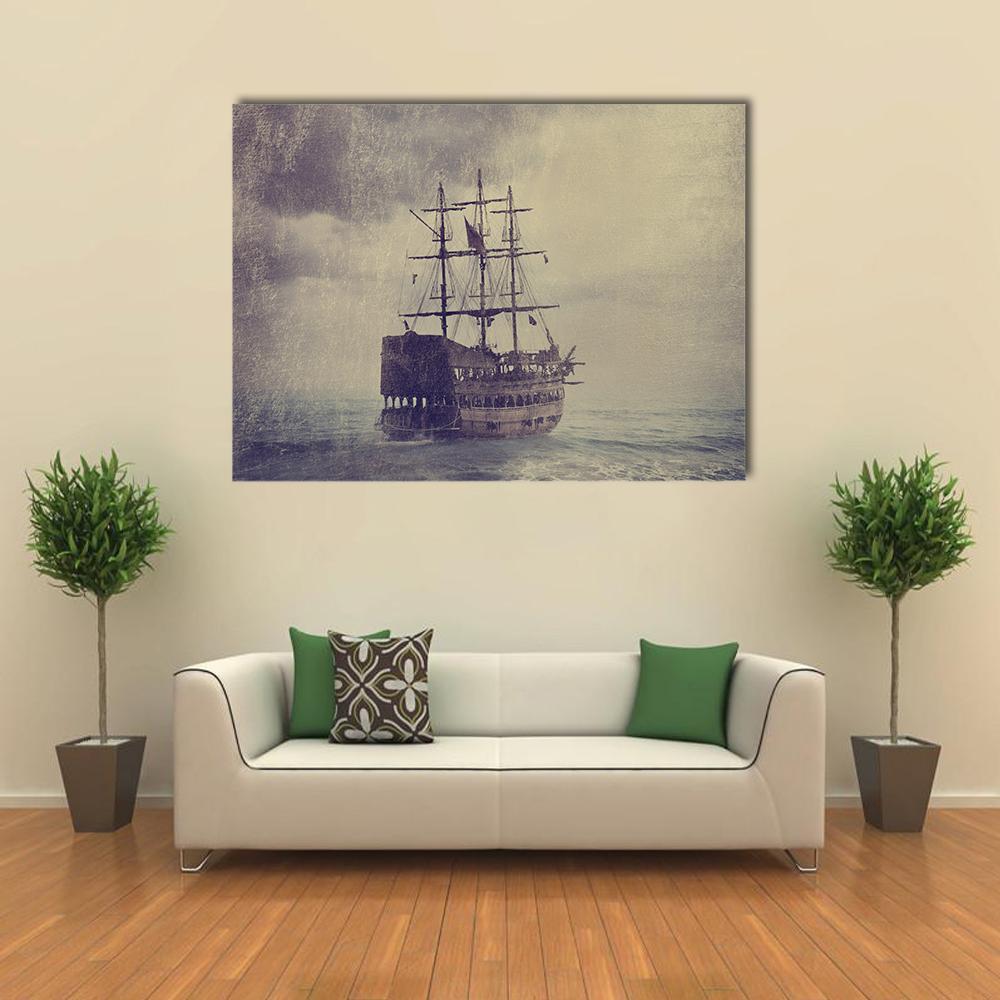 Old Pirate Ship at Sea Canvas Wall Art in gray, beige and brown, single panel hung on a wall