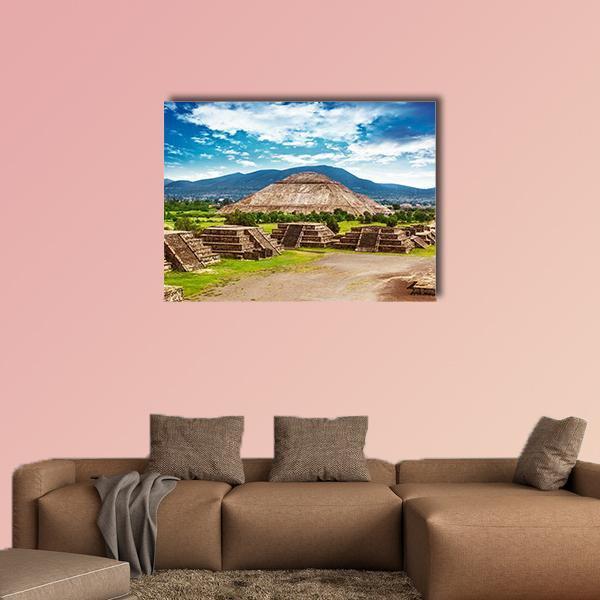 Pyramids of the Sun and Moon Canvas Wall Art in brown, green and blue, single panel hung on a wall