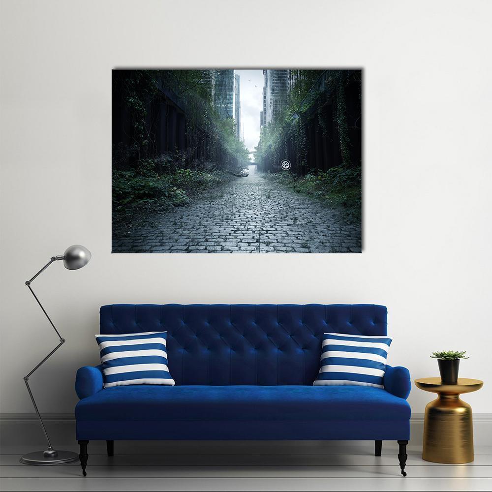 Foggy Cobblestone Street with Overgrown Buildings Canvas Wall Art in black, gray and green, single panel hung on a wall