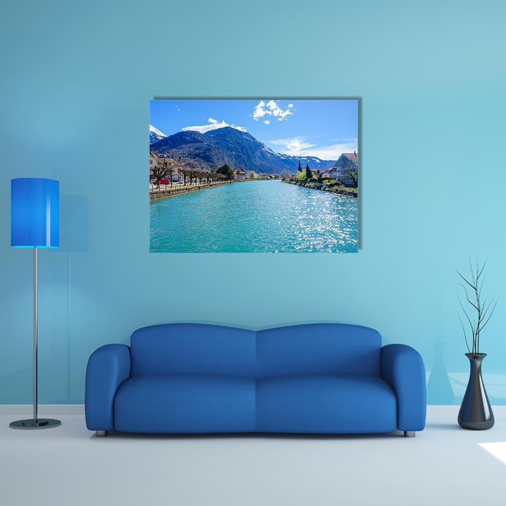 Interlaken Lake Canal Canvas Wall Art in white, green and blue, single panel hung on a wall