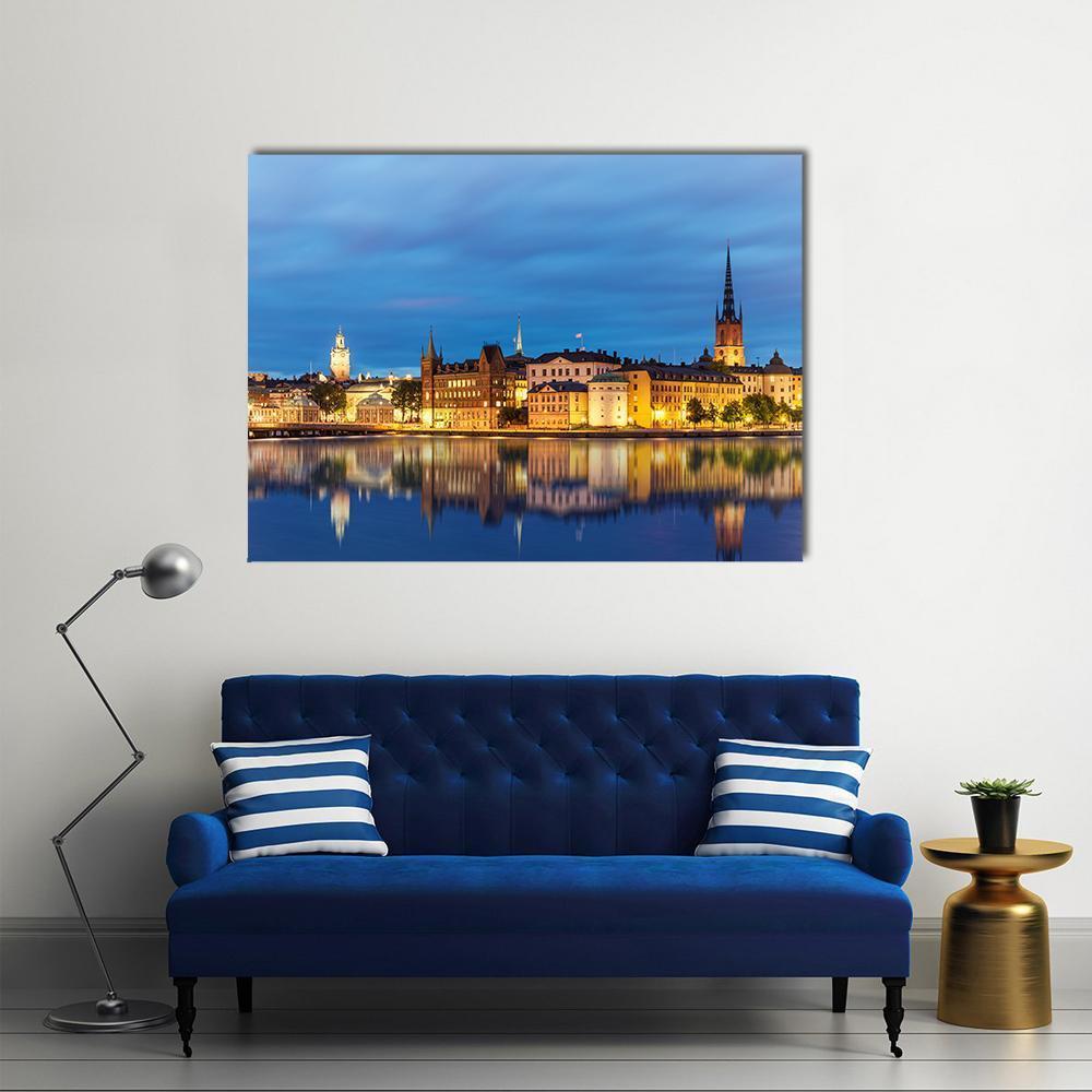Old Town Gamla Stan at Dusk Canvas Wall Art in orange, yellow and blue, single panel hung on a wall